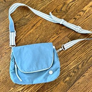 Lululemon crossbody bag, blue, adjustable strap, zipper and snap closure.
